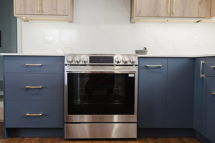 Stainless-Steel-Slide-In-Oven-With-Blue-Base-Cabinets