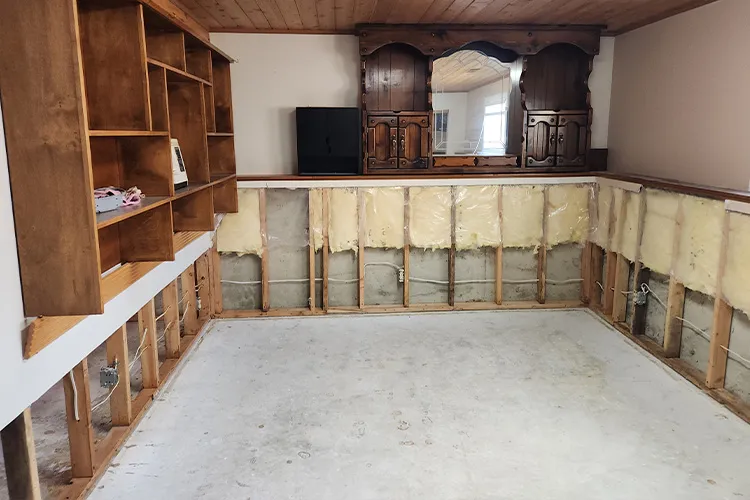 insurance-flood-restoration-03-flooded-basement-tear-out-exposed-insulation